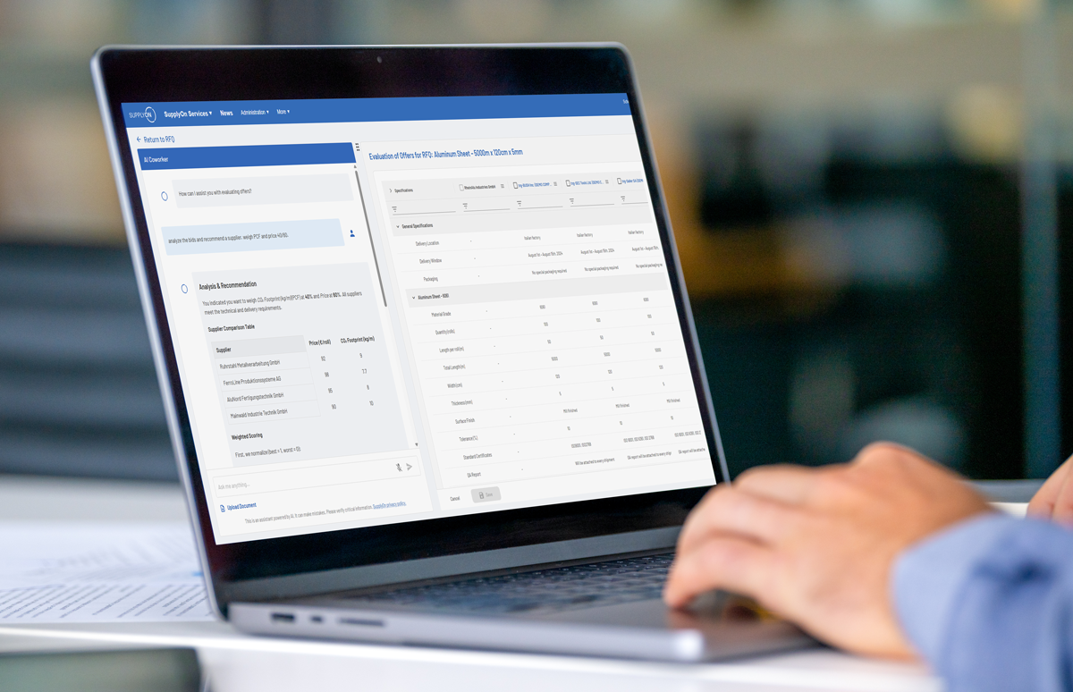 Person using a laptop displaying a data dashboard interface with tables and navigation menus on the screen.